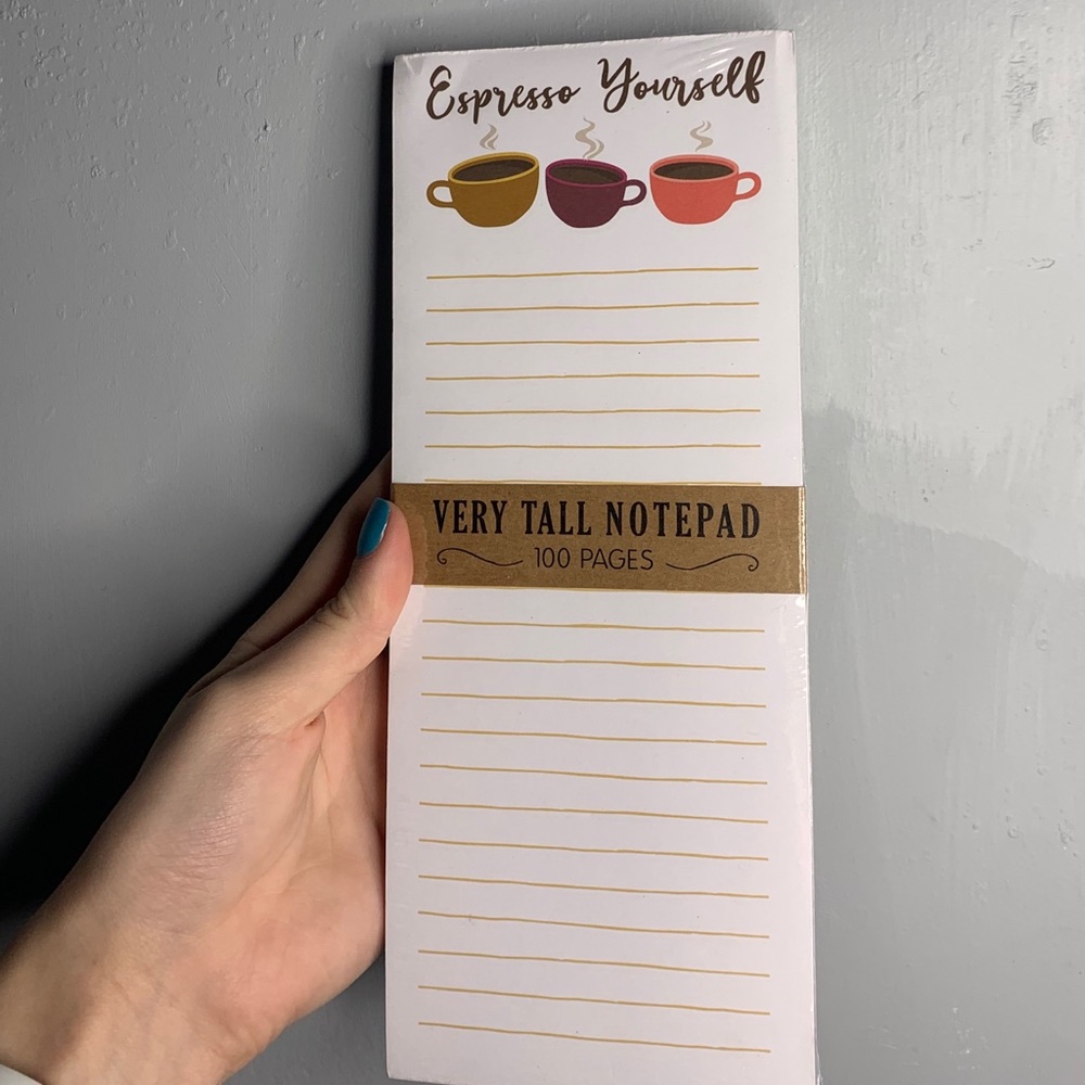 A very tall notepad with magnet attached to back
